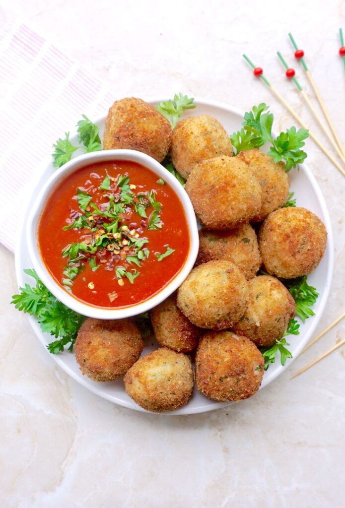 Rice Arancini with Ragù, Peas and Mozzarella