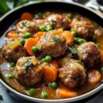 Stewed meatballs with carrots and peas are the perfect comfort food for a family dinner!