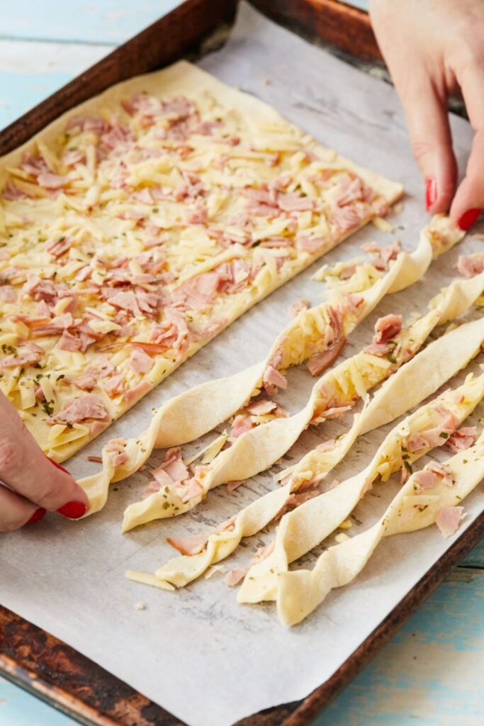 Puff pastry sticks with ham and cheese