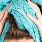 Why is it important not to dry your hair with a cotton towel?